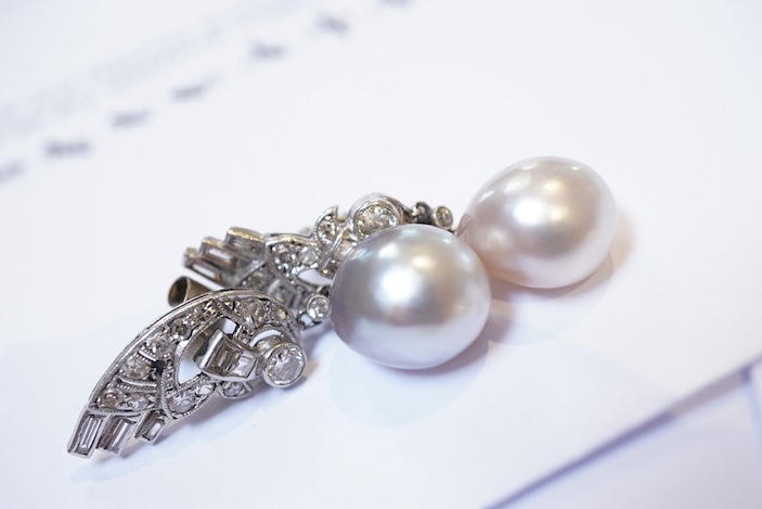 A fine pair of Art Deco natural pearl and diamond earrings, 1930s